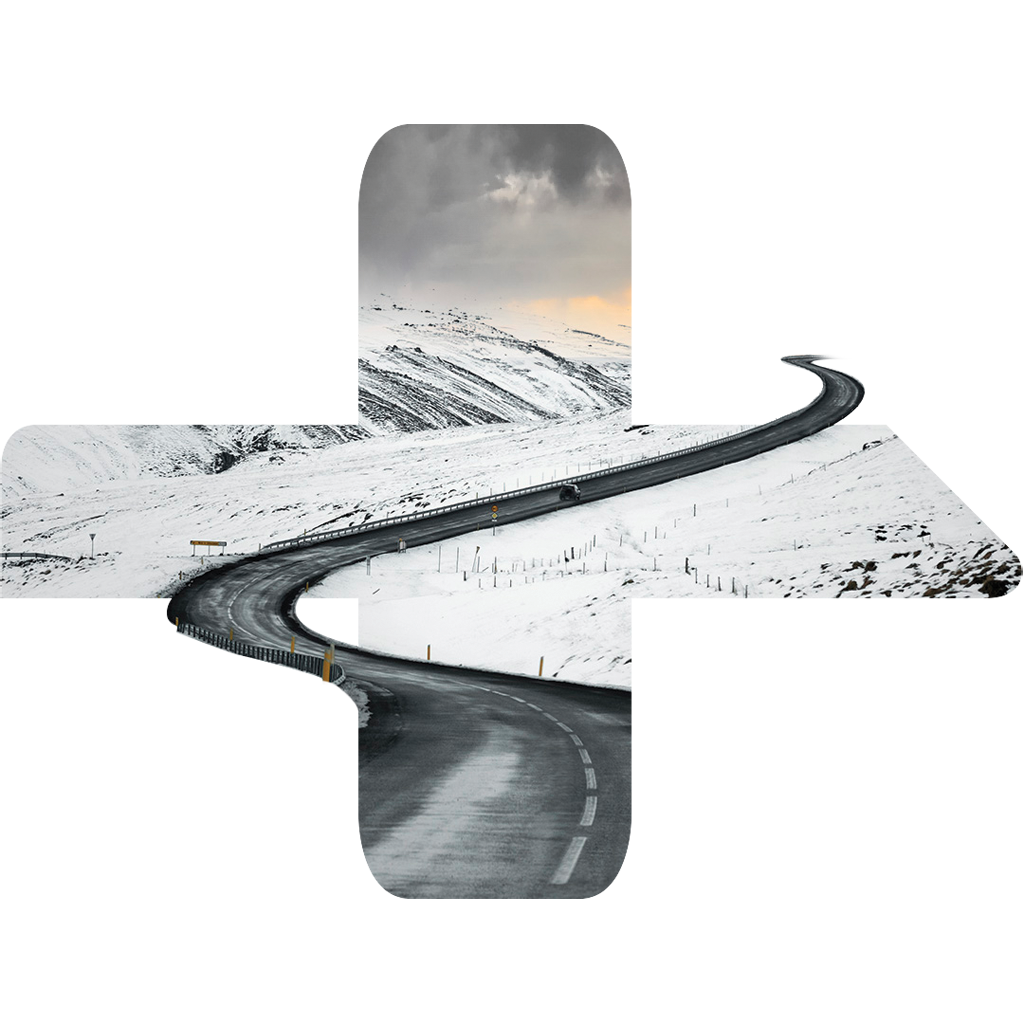 Vei gjennom et snødekt landskap.